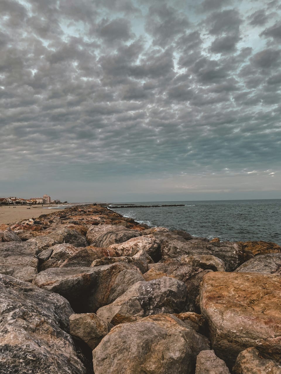 Rocky breakwater along the Saint-Cyprien coastline