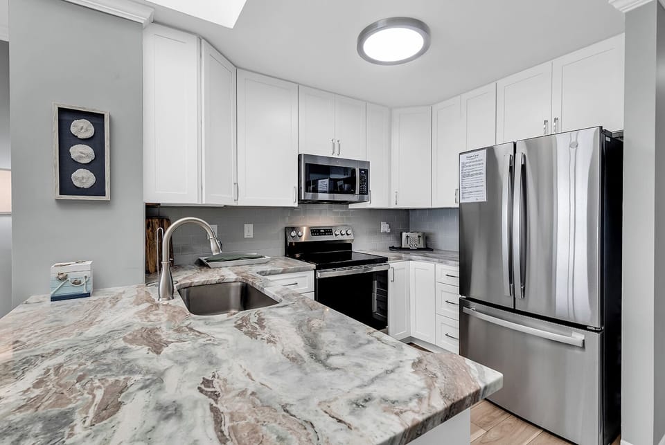 Completely upgraded kitchen, fully equipped with dishes, cookware, & utensils.