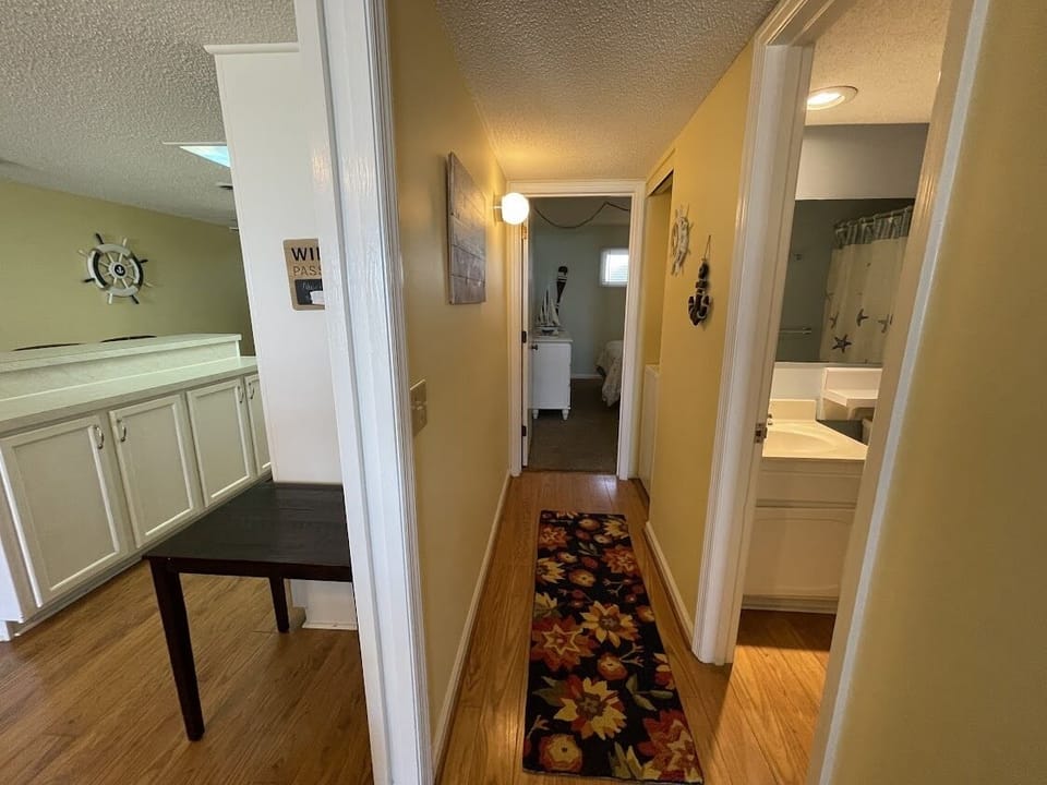Hall between bedrooms has Washer/Dryer and bath 2 access