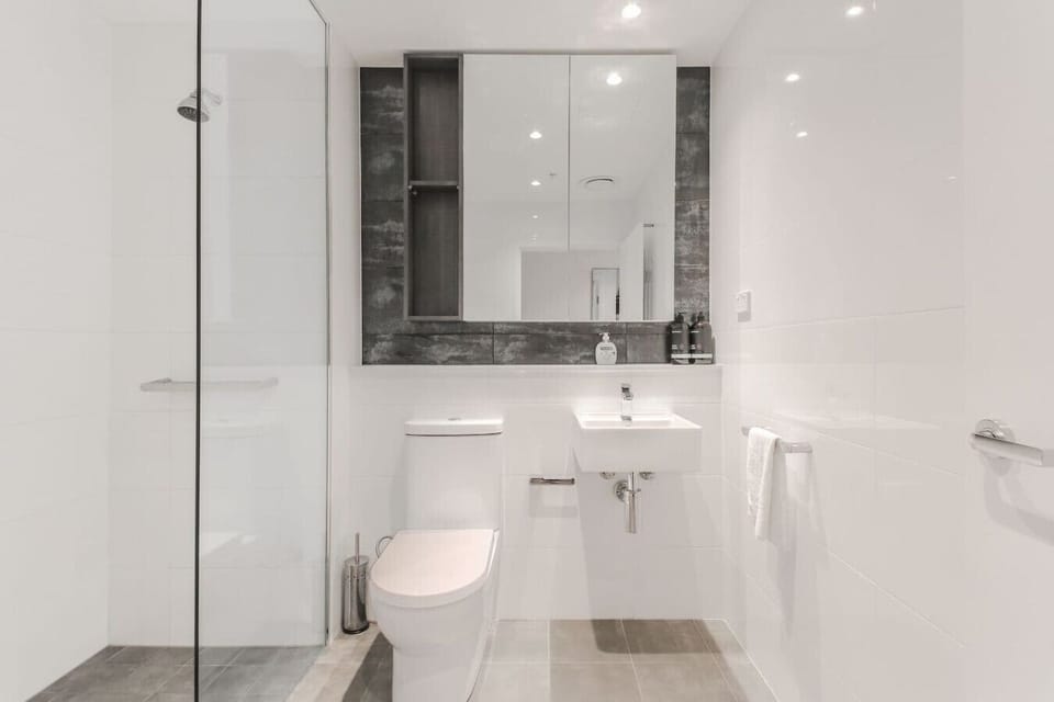full bathroom with toilet and shower