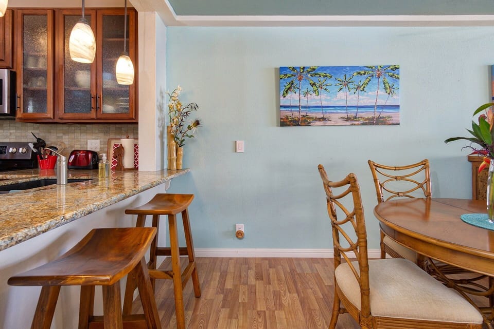 Dining area and desk space with direct sea views — perfect for meals, remote work, or planning your island adventures.