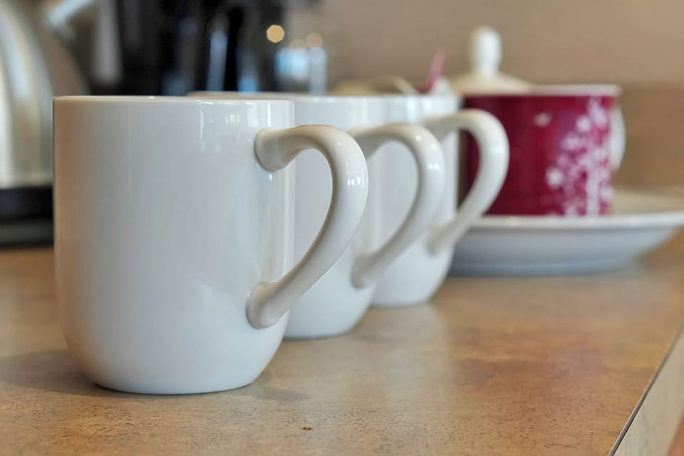 No need to pack the basics; our kitchen is move-in ready with a full set of cutlery and dinnerware