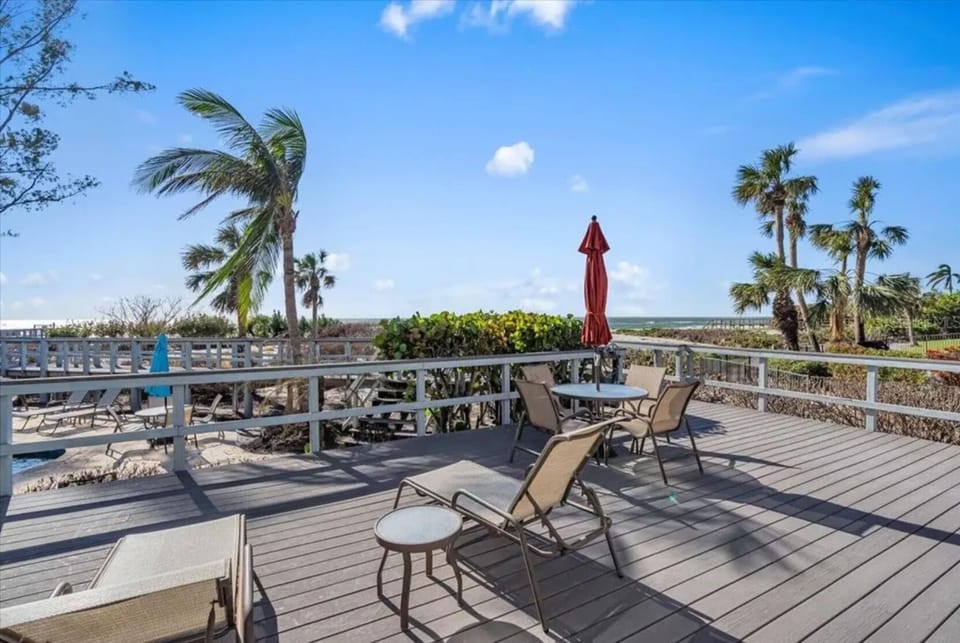 Back porch to beach in steps. Stop by the beautiful pool on your way!