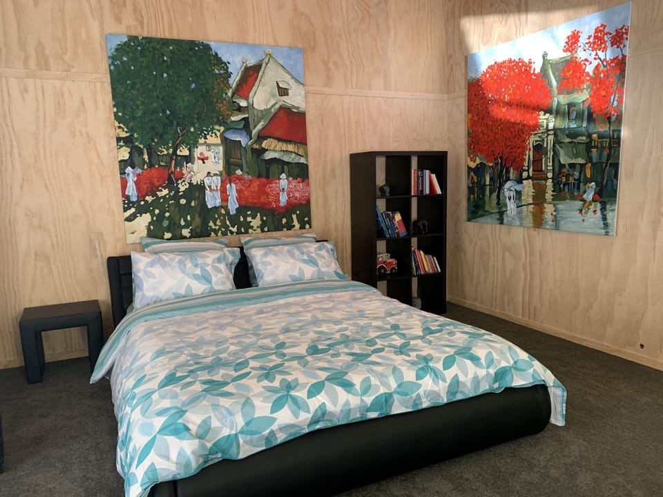 Second bedroom with double bed and TV.