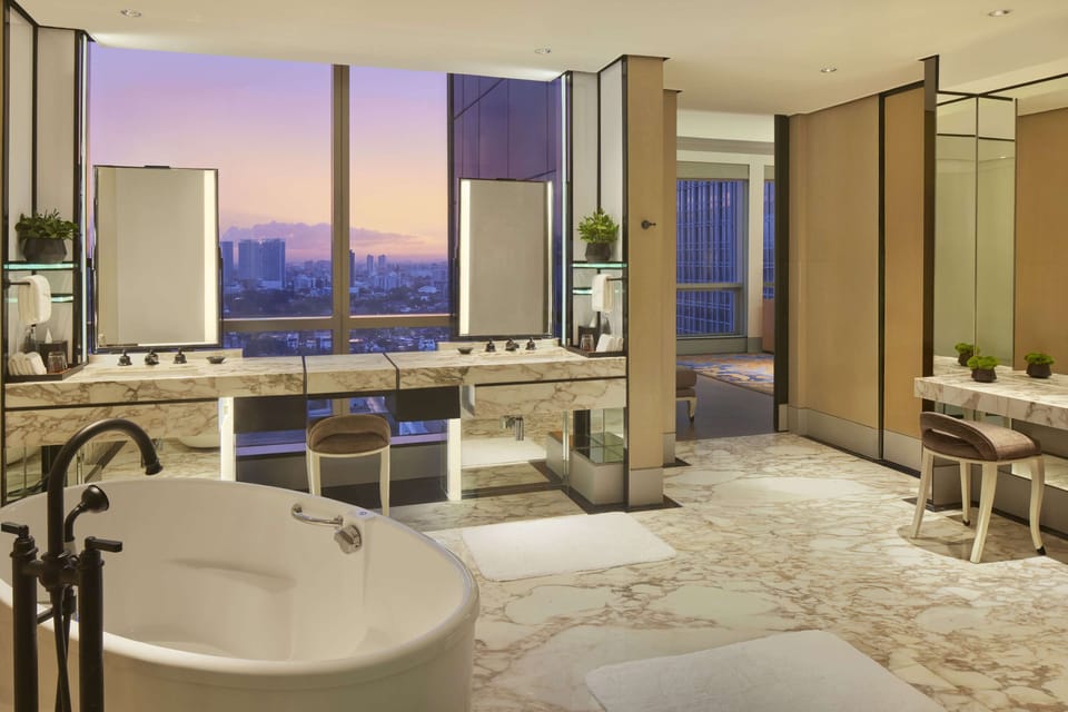 Suite, 1 King Bed | Bathroom | Separate tub and shower, deep soaking tub, rainfall showerhead