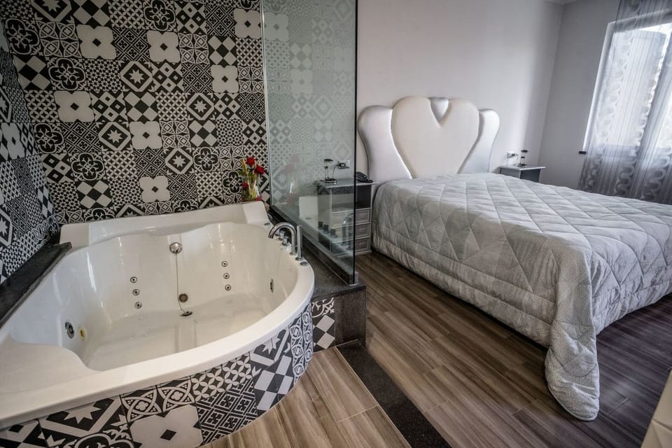 Junior Suite, Jetted Tub | Memory foam beds, in-room safe, desk, blackout drapes