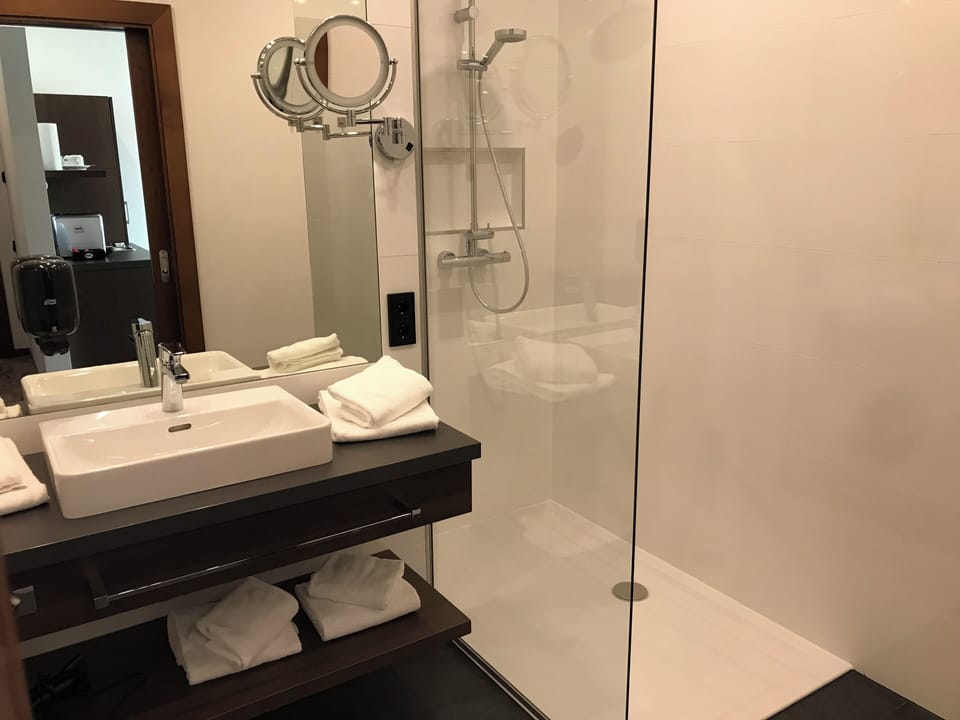 Superior Apartment, 2 Twin Beds | Bathroom | Shower, rainfall showerhead, hair dryer, heated floors