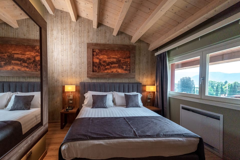 Classic Double Room, Partial Lake View | Down comforters, minibar, desk, soundproofing