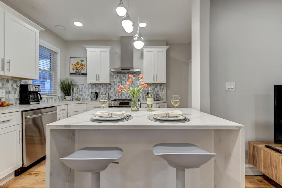 Brand-new kitchen and island table with seating for two.