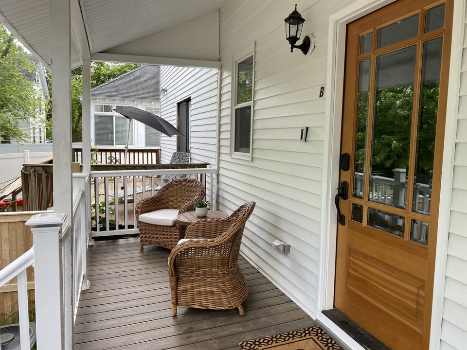Porch with comfortable seating for two.