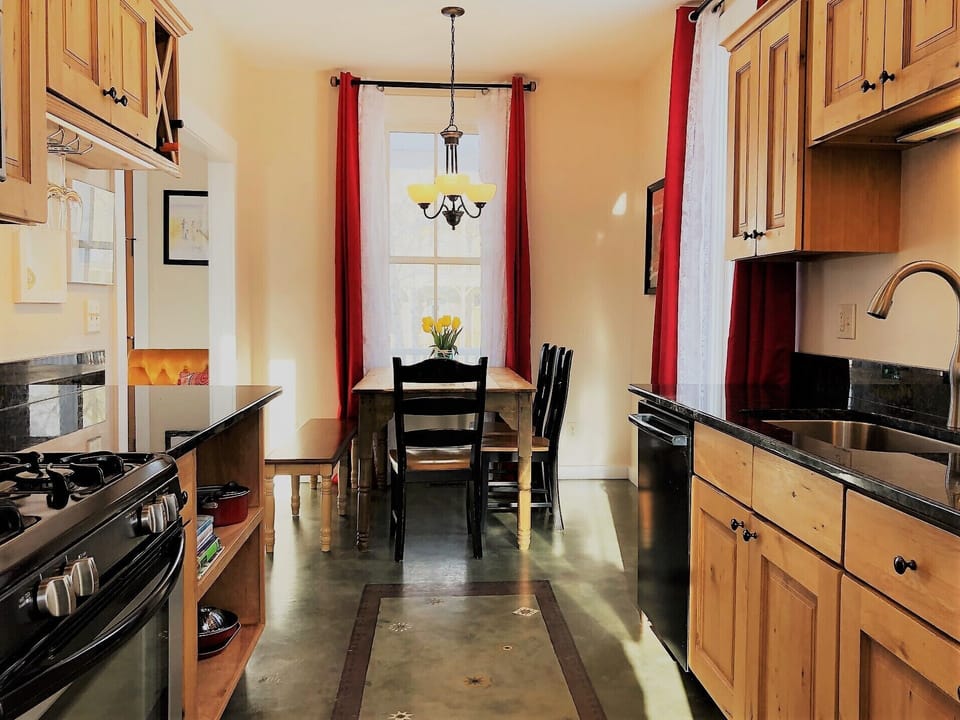 Warm and Inviting galley kitchen with new granite counter tops.

