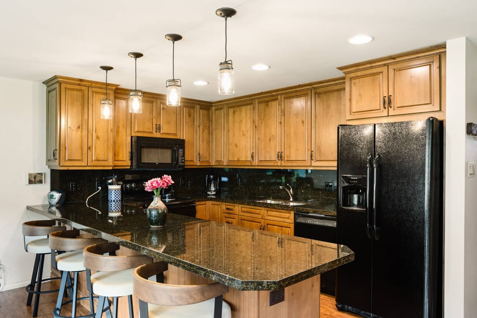 A dining table for 6 and breakfast bar for 4 provides ample dining seating for your group to easily enjoy dining at home.