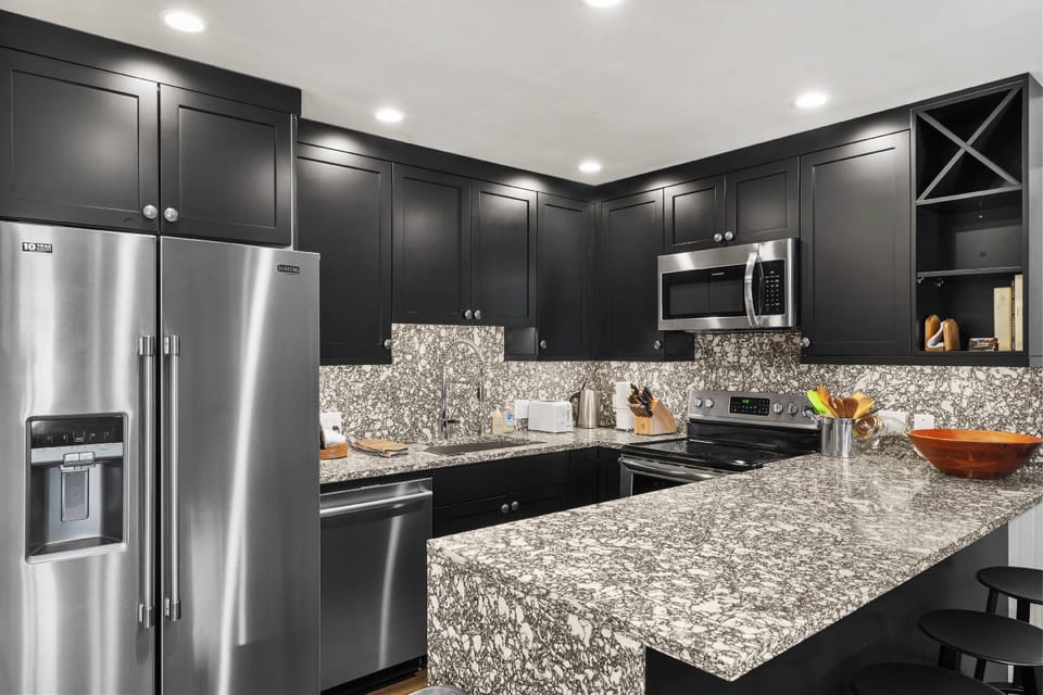 Enjoy a coffee, glass of wine or afternoon snack at the breakfast bar.  The fully stocked kitchen meets all your cooking needs!