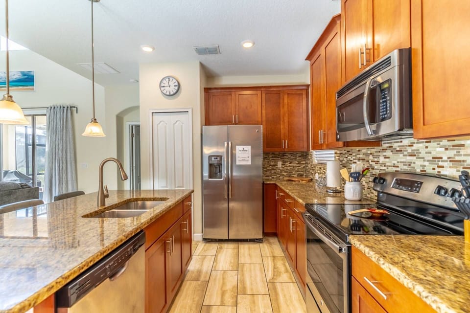 Fully Stocked kitchen with stainless steel appliances and granite counters