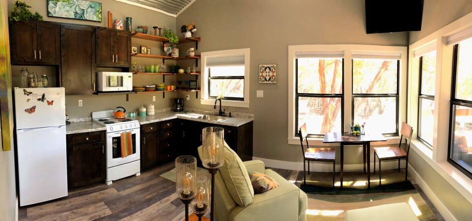 Open floor plan includes full kitchen and living room and dining area