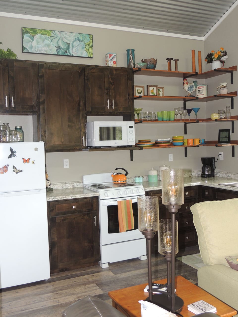 Full kitchen is stocked with coffee, teas and basic pantry items