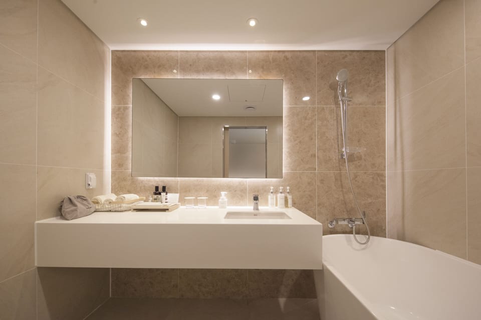 Premium Room | Bathroom | Designer toiletries, hair dryer, bathrobes, slippers