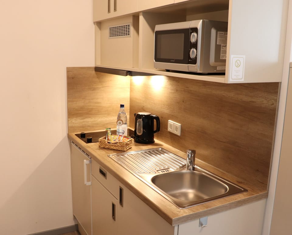 Double or Twin Room | Private kitchenette | Full-size fridge, microwave, stovetop, coffee/tea maker