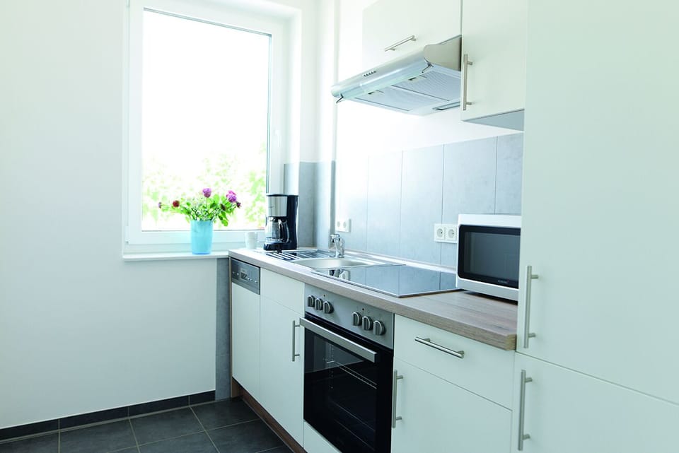 Full-size fridge, microwave, stovetop, coffee/tea maker