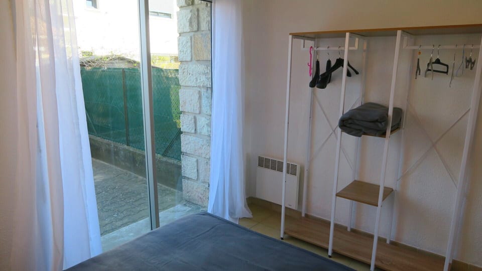 The bedroom with storage overlooking the east-facing terrace