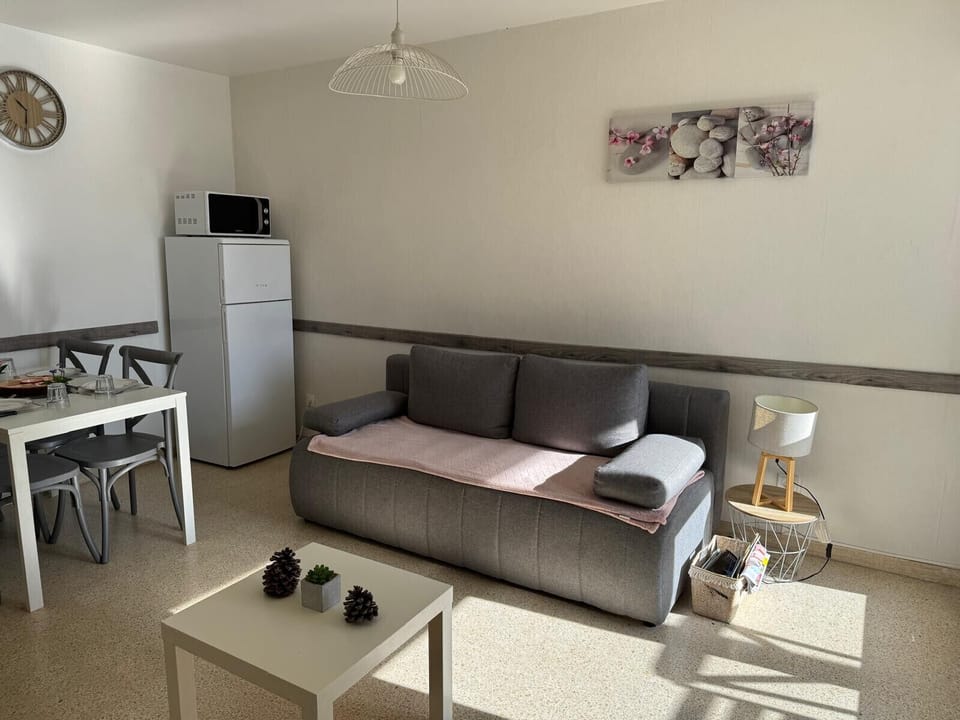 Bright living room with sofa bed for 2 people overlooking the loggia facing south east