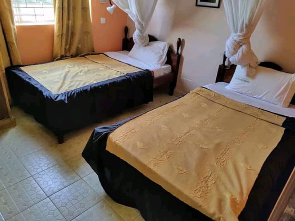 Family Room | Desk, iron/ironing board, bed sheets