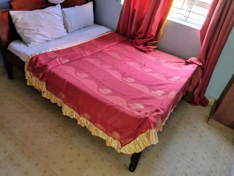 Family Room | Desk, iron/ironing board, bed sheets