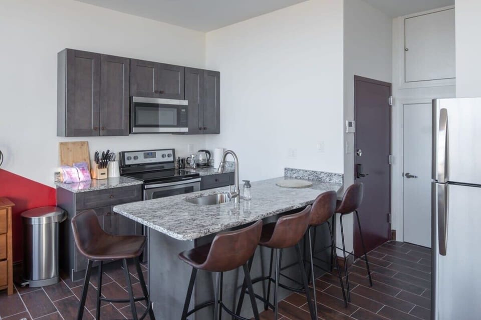 Full size kitchen with a marble counter