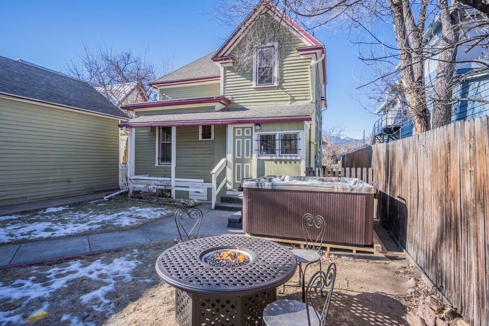 Enjoy the charm of a Victorian-style home, then step out back for fresh air and a relaxing soak in the hot tub.