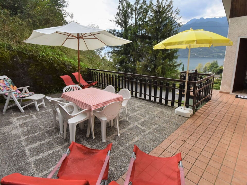 Plant, Furniture, Property, Umbrella, Chair, Sky, Outdoor Table, Outdoor Furniture, Shade, Architecture