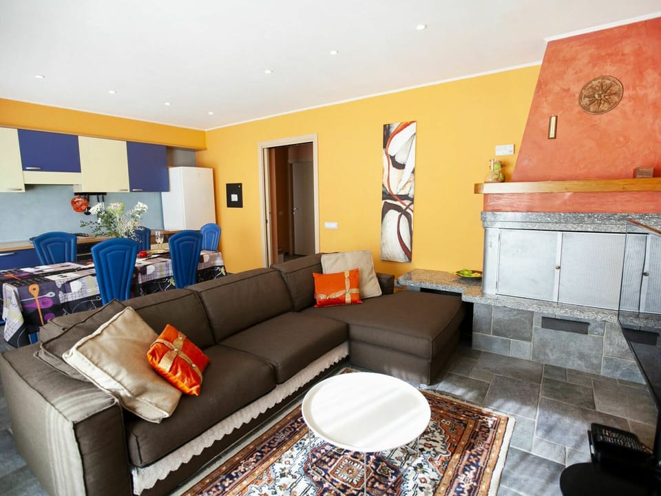 Couch, Table, Property, Furniture, Picture Frame, Living Room, Studio Couch, Interior Design, Orange, Comfort