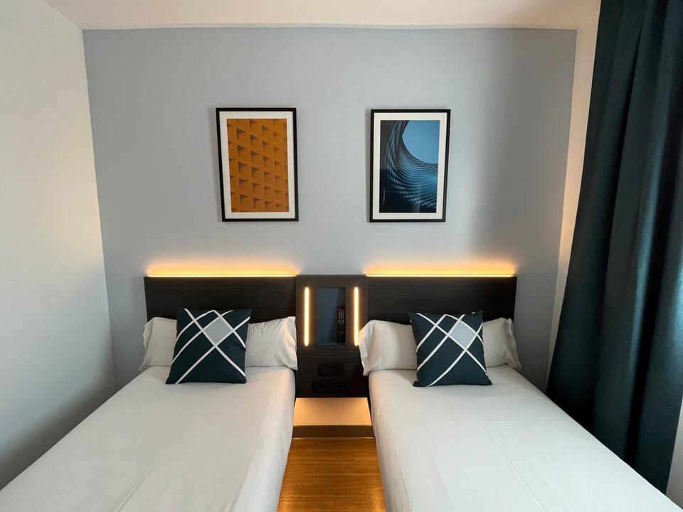 Desk, blackout drapes, soundproofing, iron/ironing board