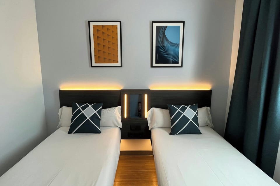 Standard Room, 2 Twin Beds | Desk, blackout drapes, soundproofing, iron/ironing board