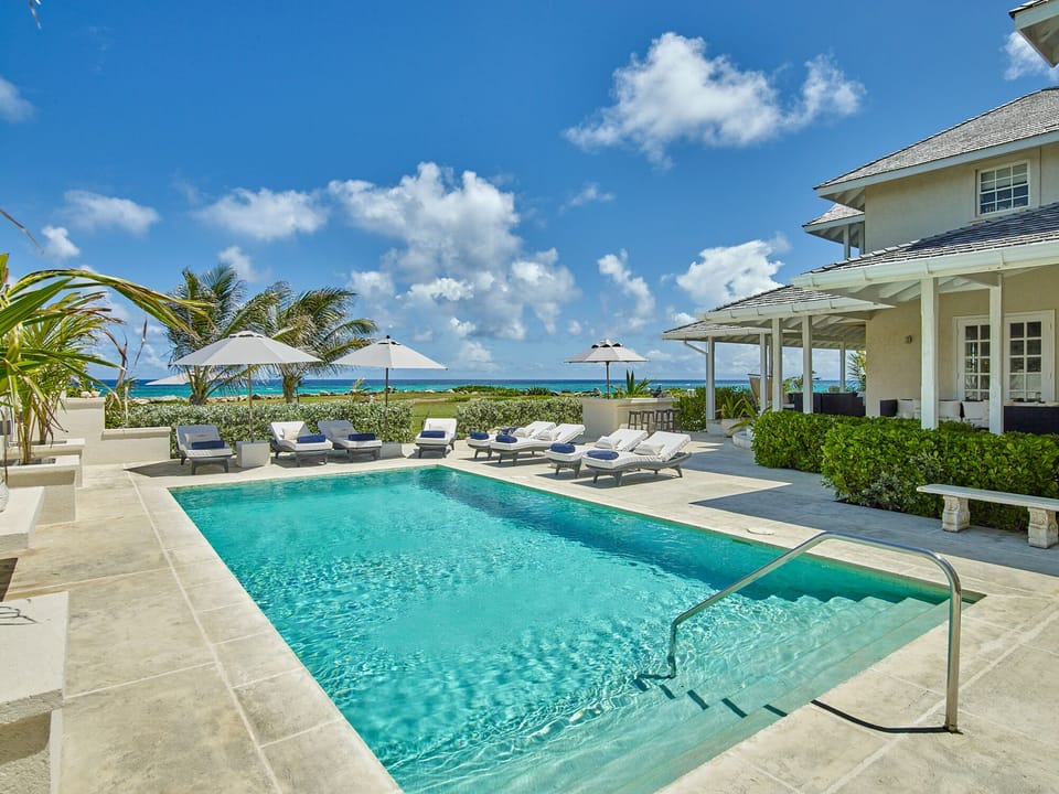 View of the ocean across the pool deck