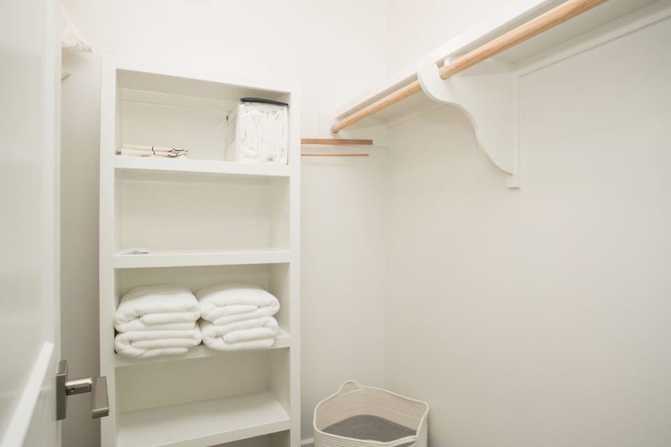 One of the two walk-in closets. 