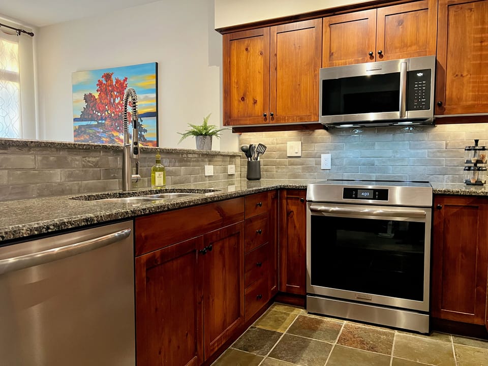 Kitchen with new Frigidaire Gallery appliances including induction range