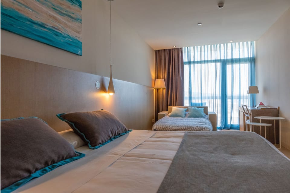 Family Quadruple Room, Balcony (2 adults and 2 children) | In-room safe, desk, laptop workspace, soundproofing