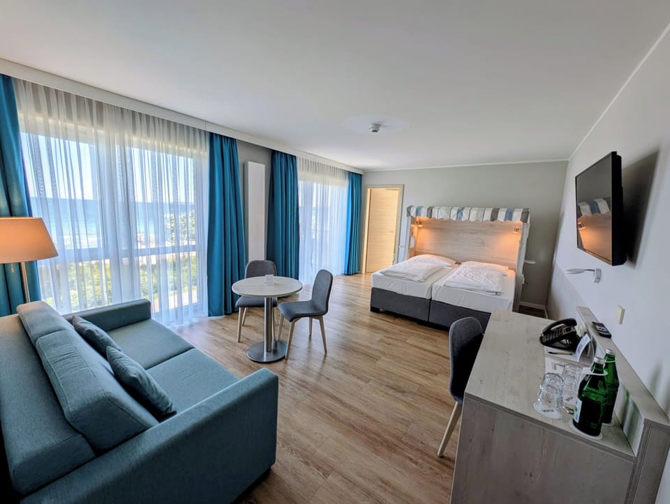 Family Room | Hypo-allergenic bedding, minibar, in-room safe, desk