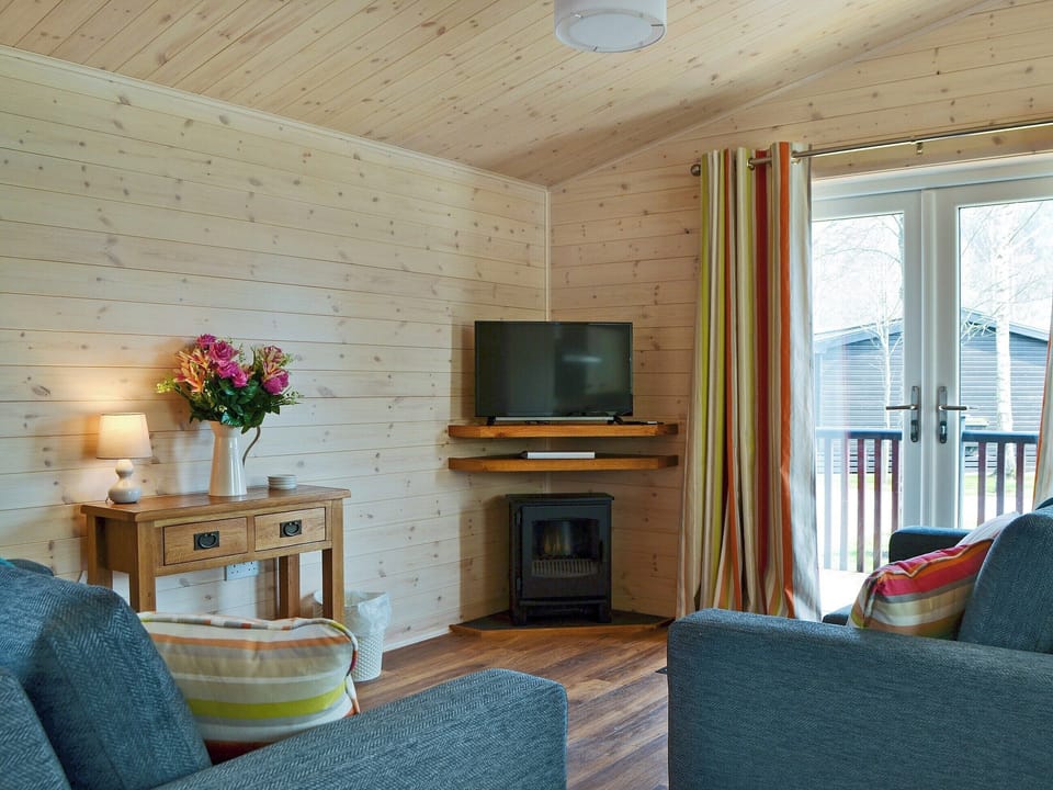 Delightful living area with balcony access | Bransty, Burnside Park