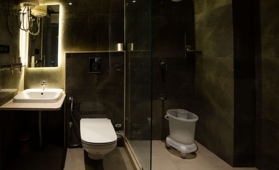 Shower, hair dryer, slippers, towels