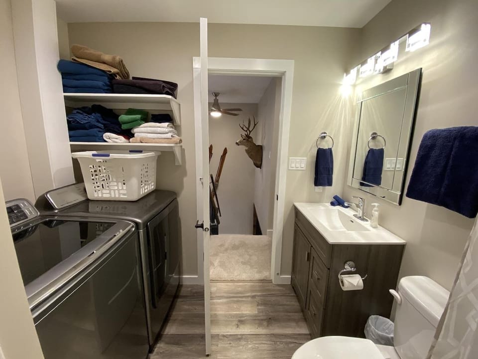 The upstairs bathroom with shower and full laundry facilities.