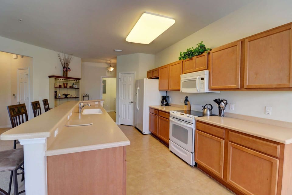 The uncluttered kitchen features tons of counter space and a full pantry, allowing lots of room for you to feel at home.