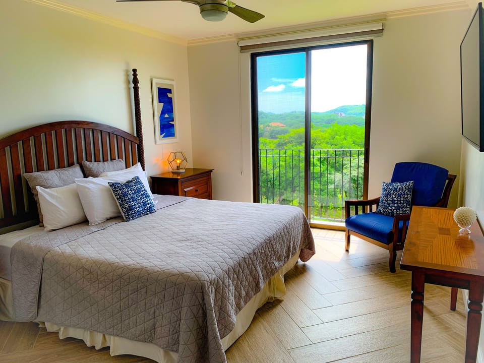King bed in master bedroom #1 with ocean views from Juliette balcony