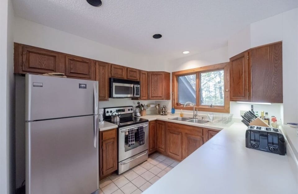 Kitchen fully stocked with pots, pans,  & utensils 