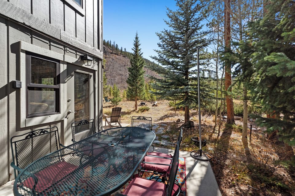 Step onto your private balcony and breathe in the crisp mountain air while enjoying forest views from your outdoor dining space.