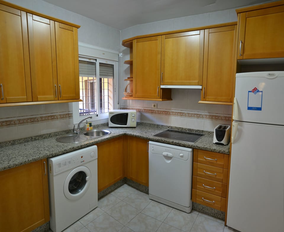 Apartment, 2 Bedrooms | Private kitchen | Fridge, microwave, stovetop, coffee/tea maker