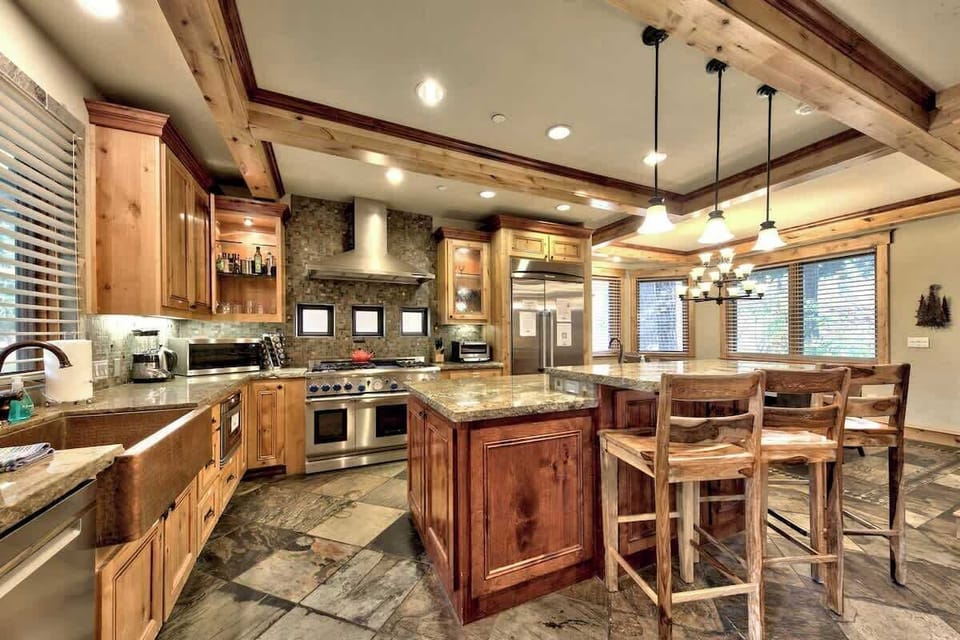 Higher end gas range and kitchen, well equipped with bakeware, cookware, dinnerware.

New dining room table, with seating for 10, plus extra seating at the island.