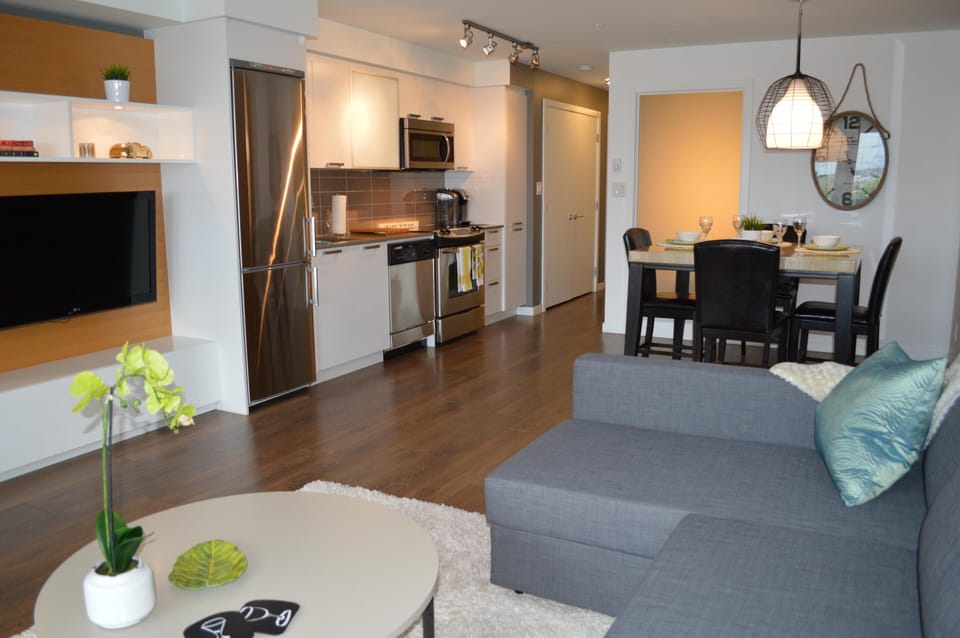 Central living zone transitioning smoothly into the adjoining kitchen and dining spaces.