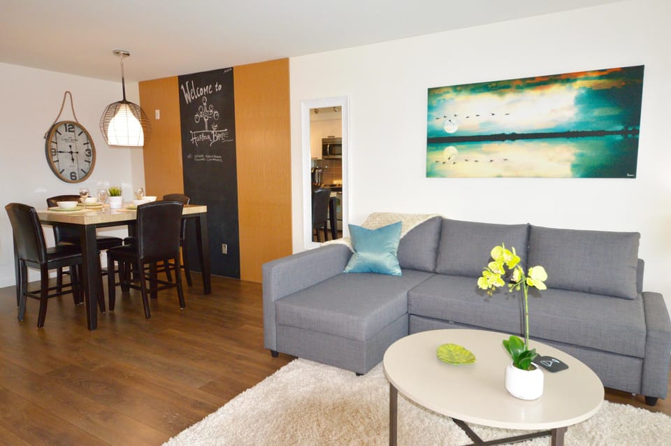 Functional living area configured with a coffee table and generous seating space for daily relaxation or hosting.