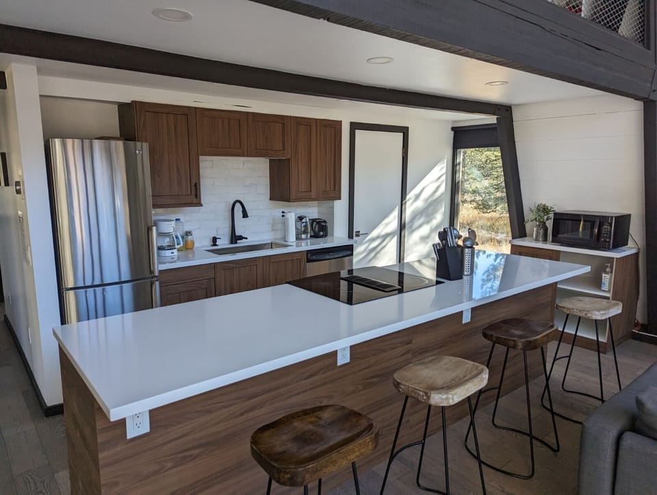 Remodeled fully stocked kitchen with breakfast bar 